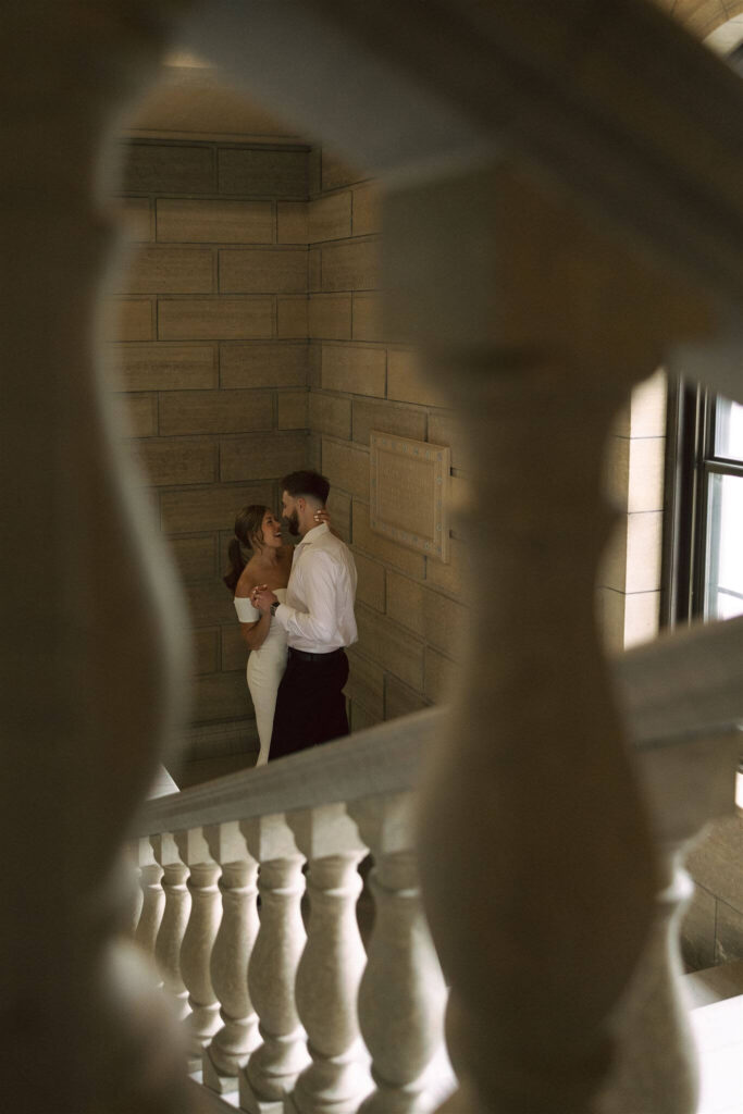 Man and woman dance in the corner of the stairwell