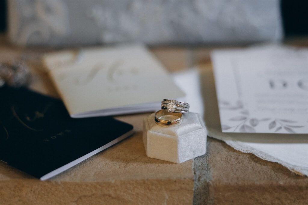 Wedding rings lay on ledge 