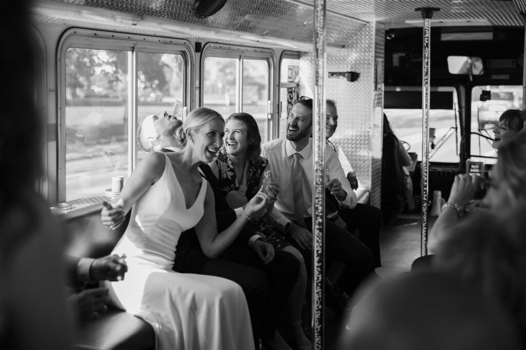 Bride and wedding guests celebrate on party bus through downtown Minneapolis