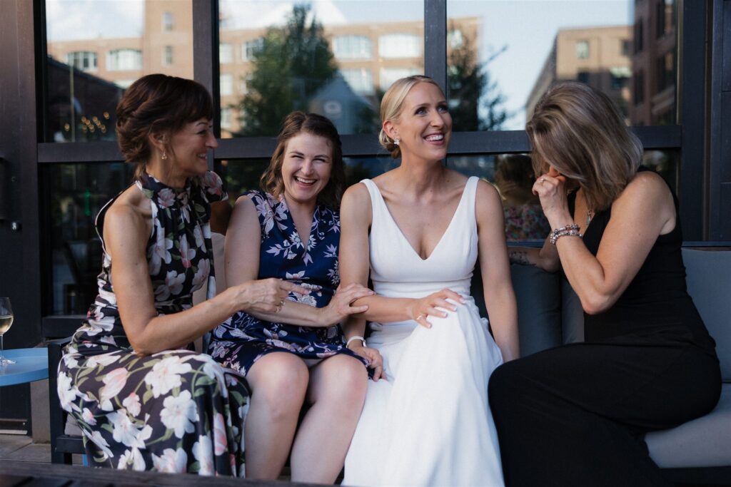 Bride and her friends laugh at Thr3 Jack in downtown Minneapolis