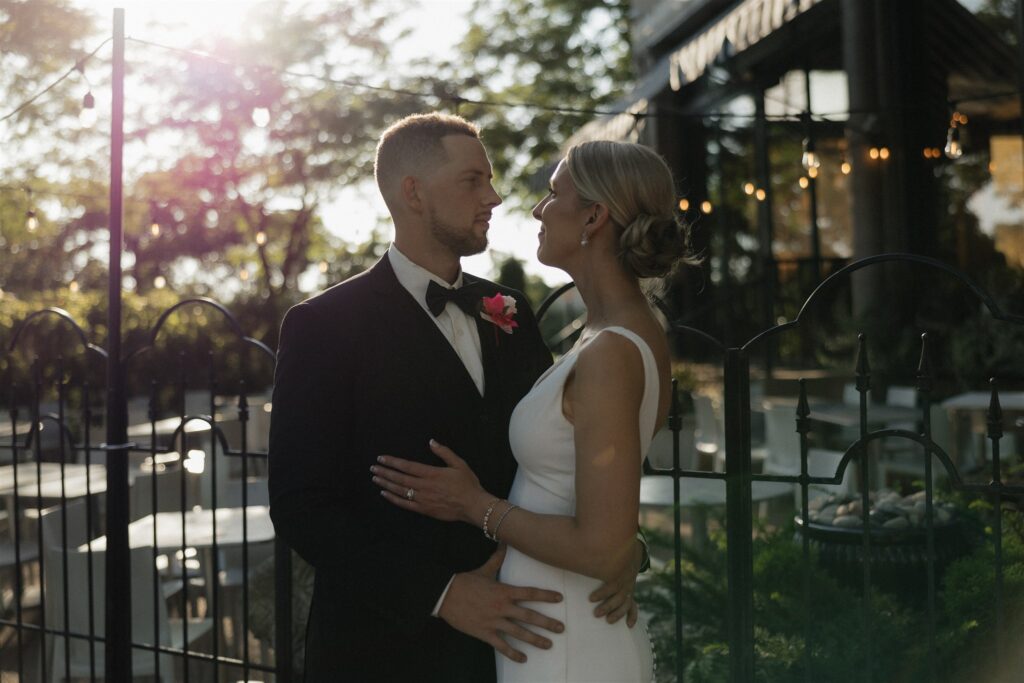 Bride and groom look at each other as they stand outside Bar Lurcat in downtown Minneapolis