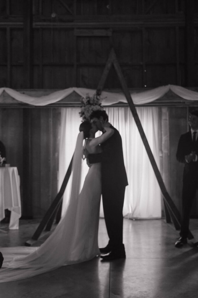 Bride and groom kiss for the first time at the end of their wedding ceremony