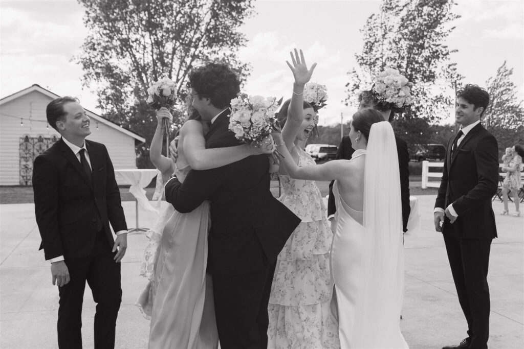 Bride and groom greet their wedding guests in receiving line