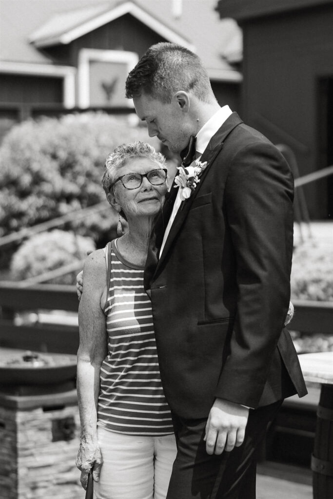 Groom smiles down at his grandma