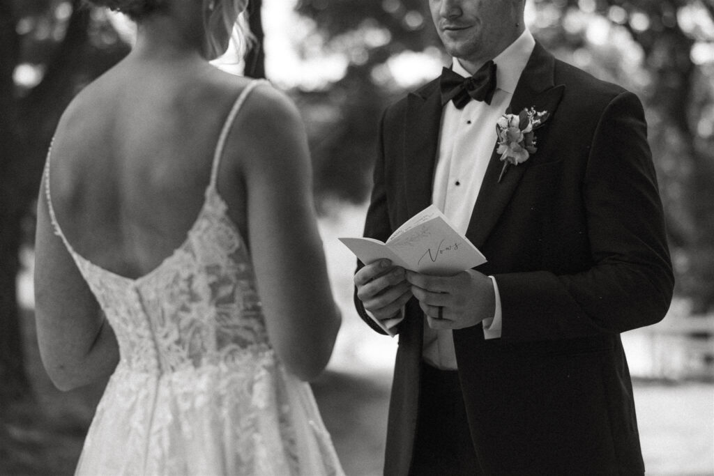 Groom reads his wedding vows to bride