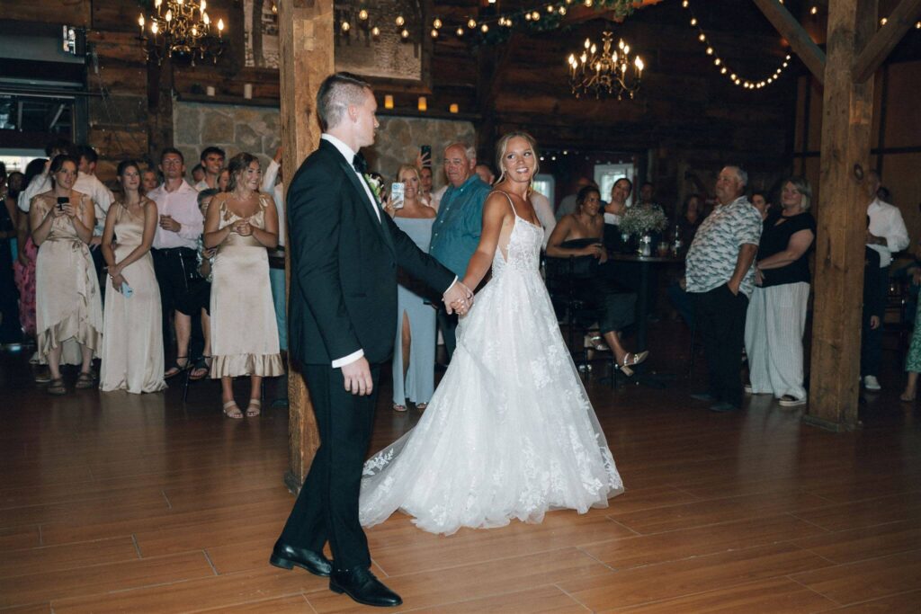 Bride leads groom onto the dance floor at Hope Glen farm wedding venue