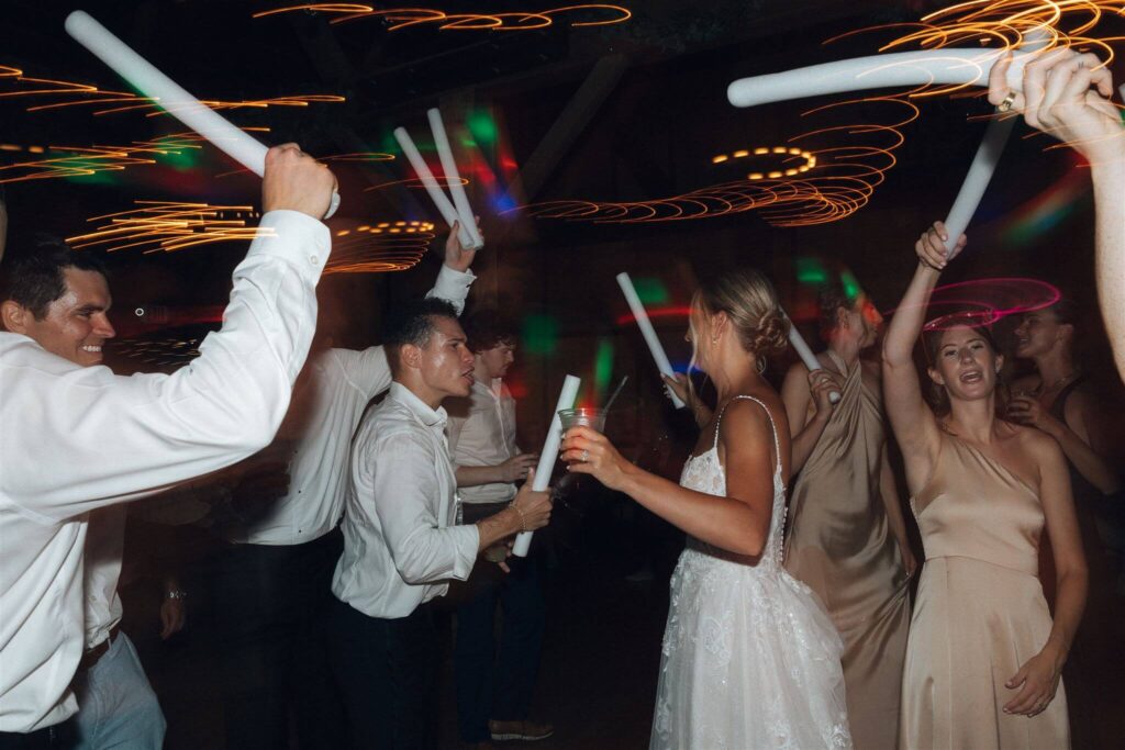 Newlyweds and guests dance at Hope Glen Farm wedding venue in Minnesota