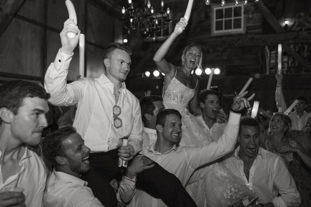 Newlyweds and guests dance at Hope Glen Farm wedding venue in Minnesota