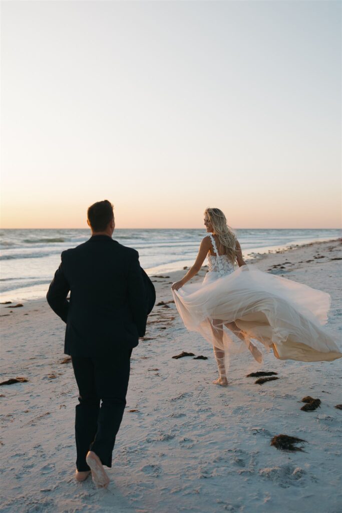 Groom chases bride down the Florida beach