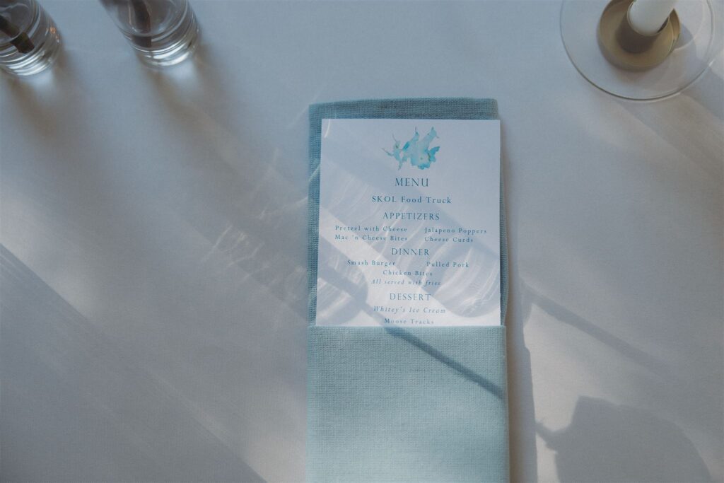 Sky blue food menu for reception of Walker, Minnesota wedding