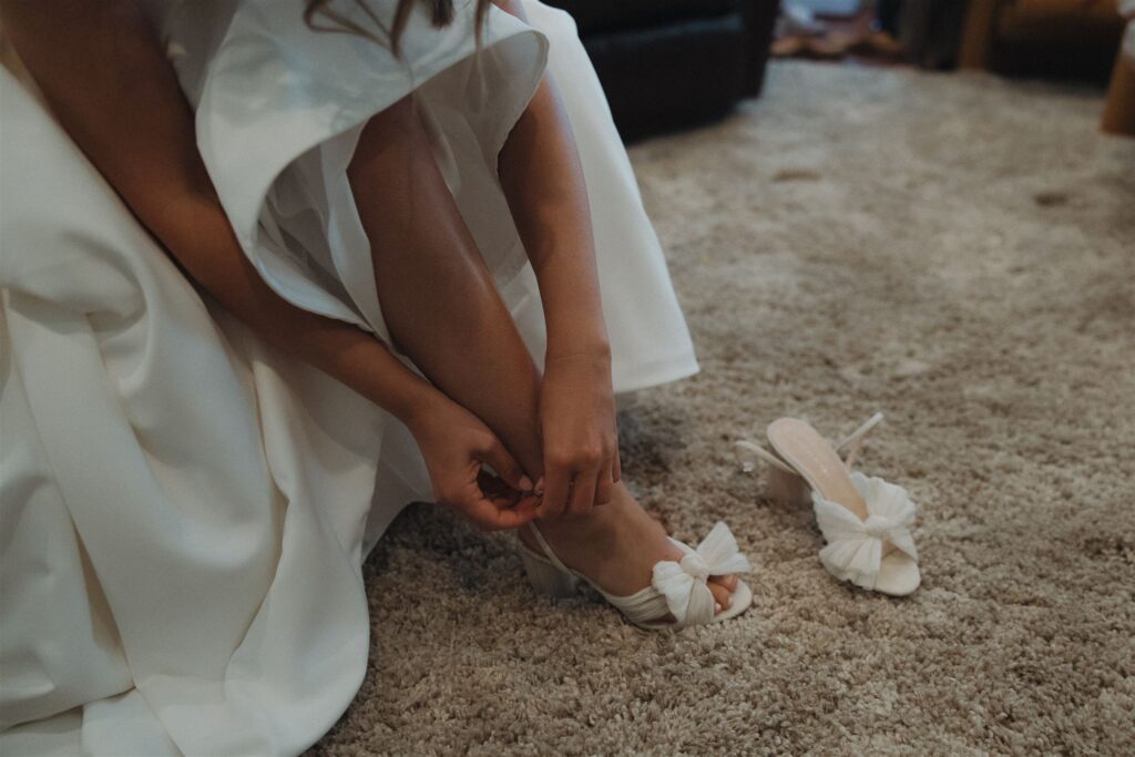 Minnesota bride buttons up her bow bridal shoes