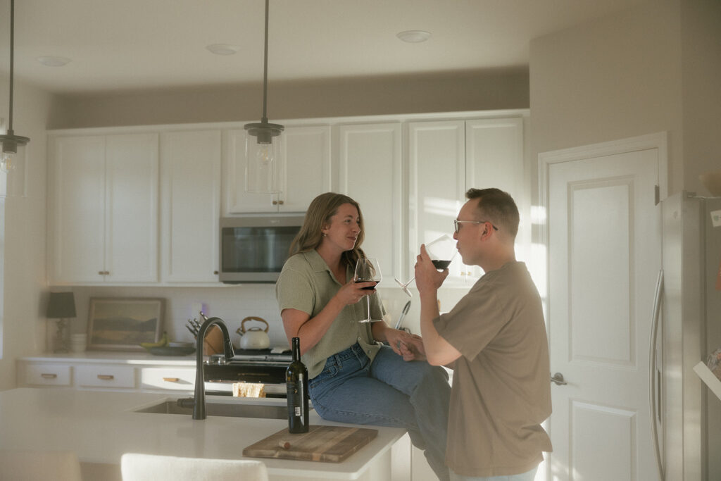 Married couple enjoys glass of red wine together