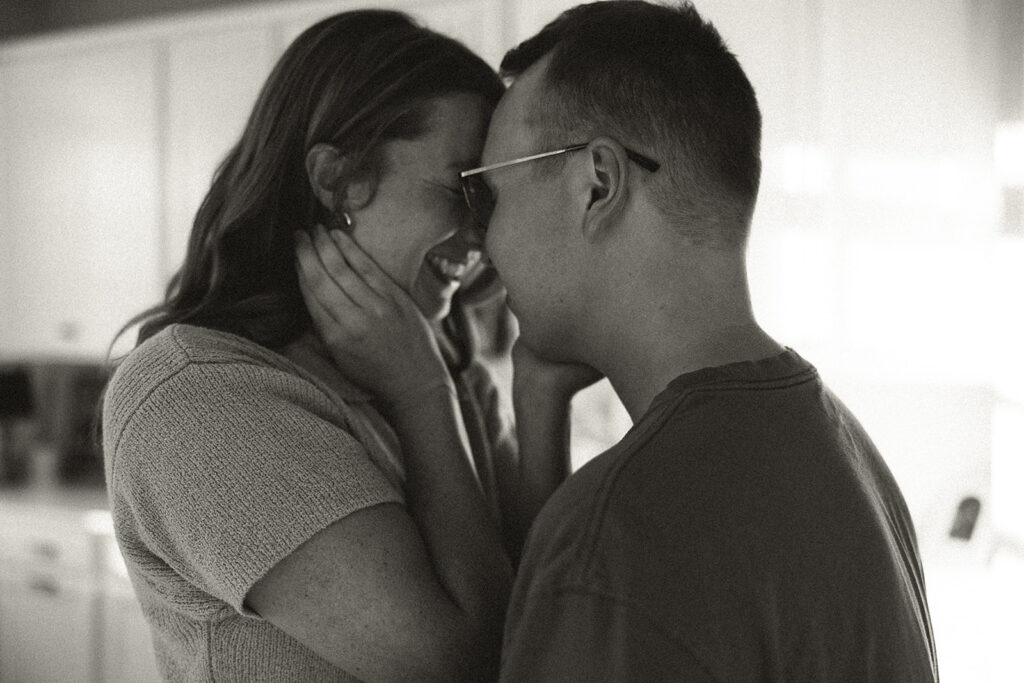 Husband and wife rest foreheads to each other's during Minnesota couples photography session