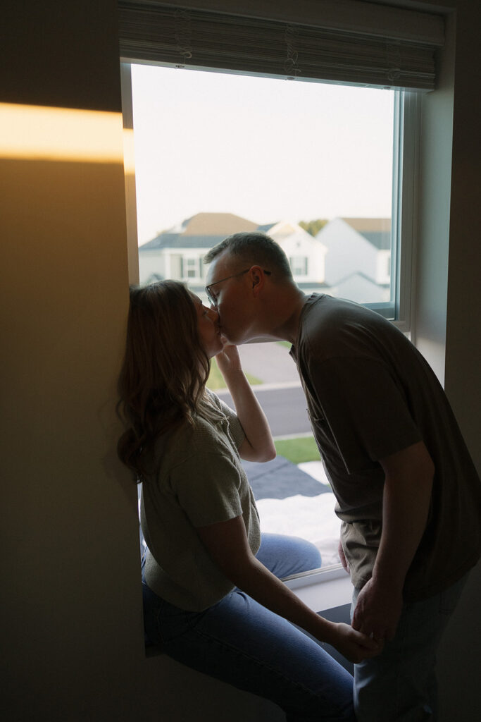 Man leans in to kiss his wife