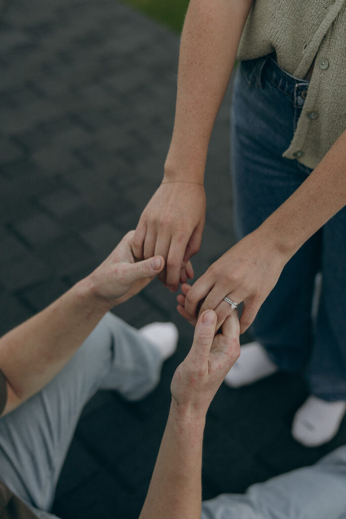 Married couple holds hands on rooftop