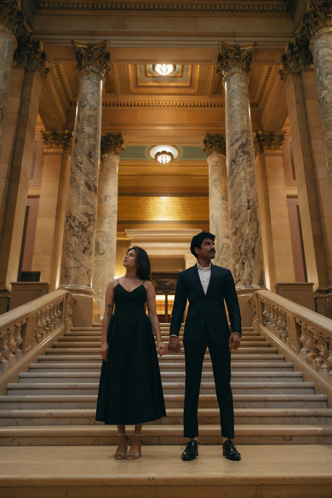 Couple framed by archway light, full of cinematic depth