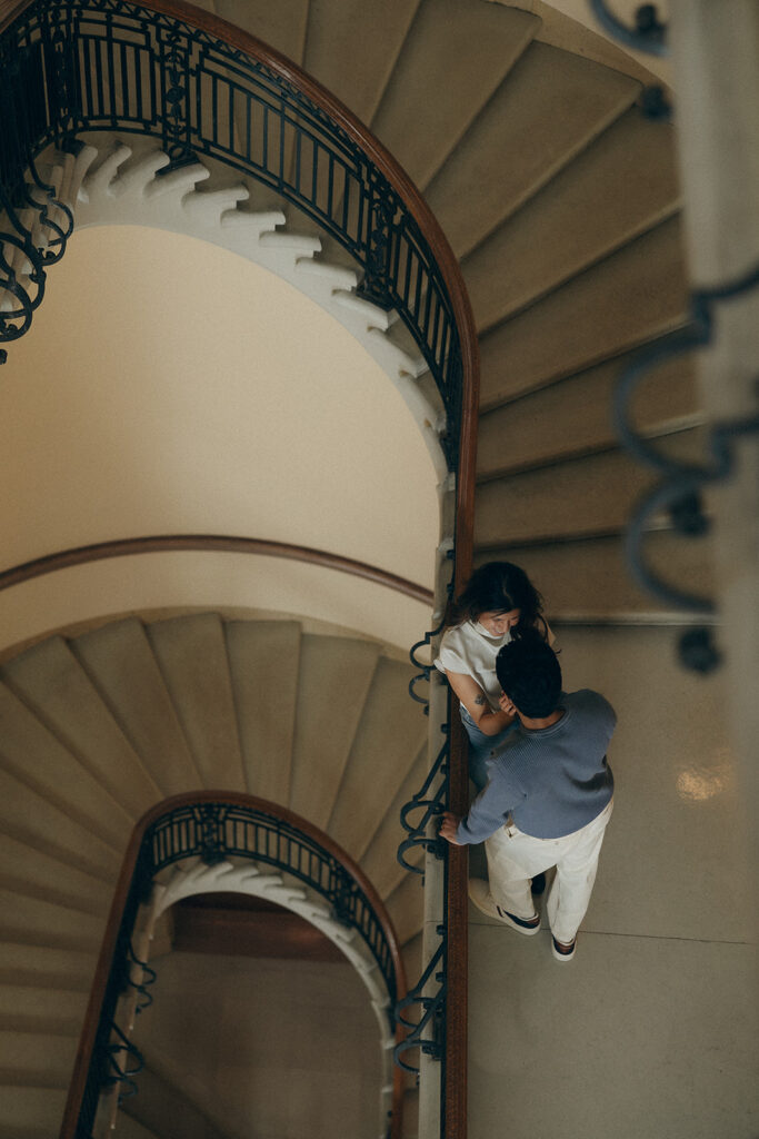 Couple dancing playfully on Capitol steps, evoking film-inspired romance