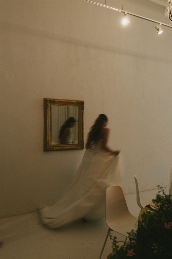 Bride runs around candlelit microwedding reception space in downtown Minneapolis
