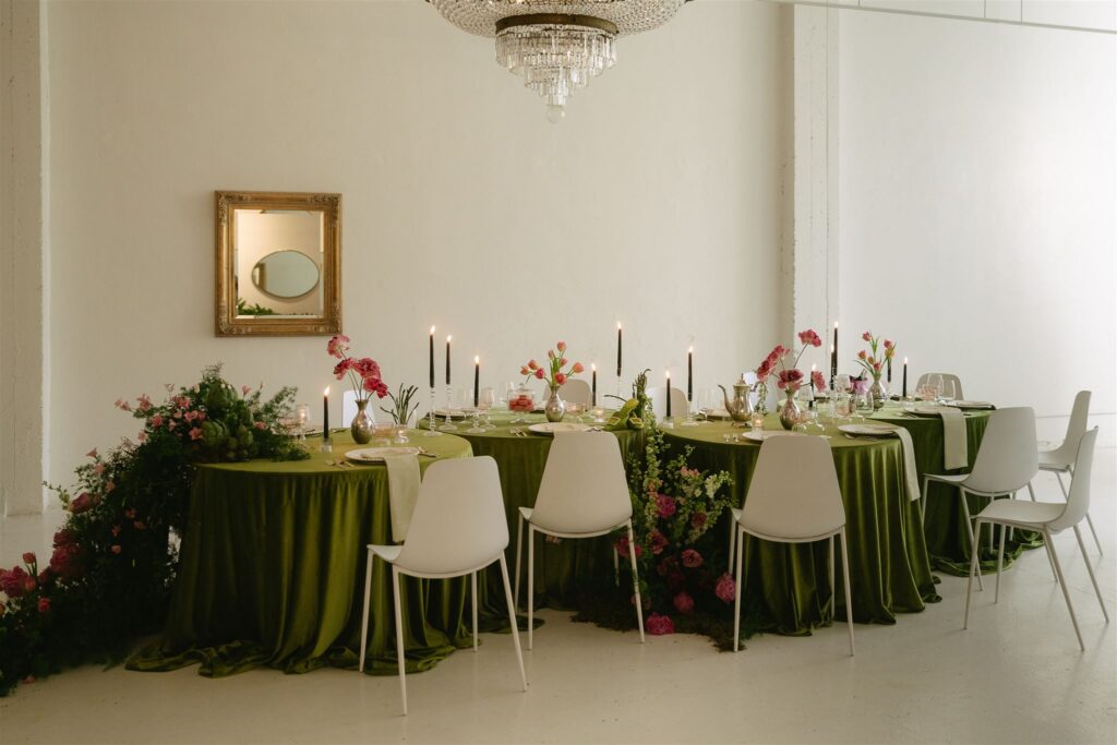 Gorgeous microwedding tablescapes with Wicked inspired linens, vibrant and cascading floral arrangements, and French-inspired etails