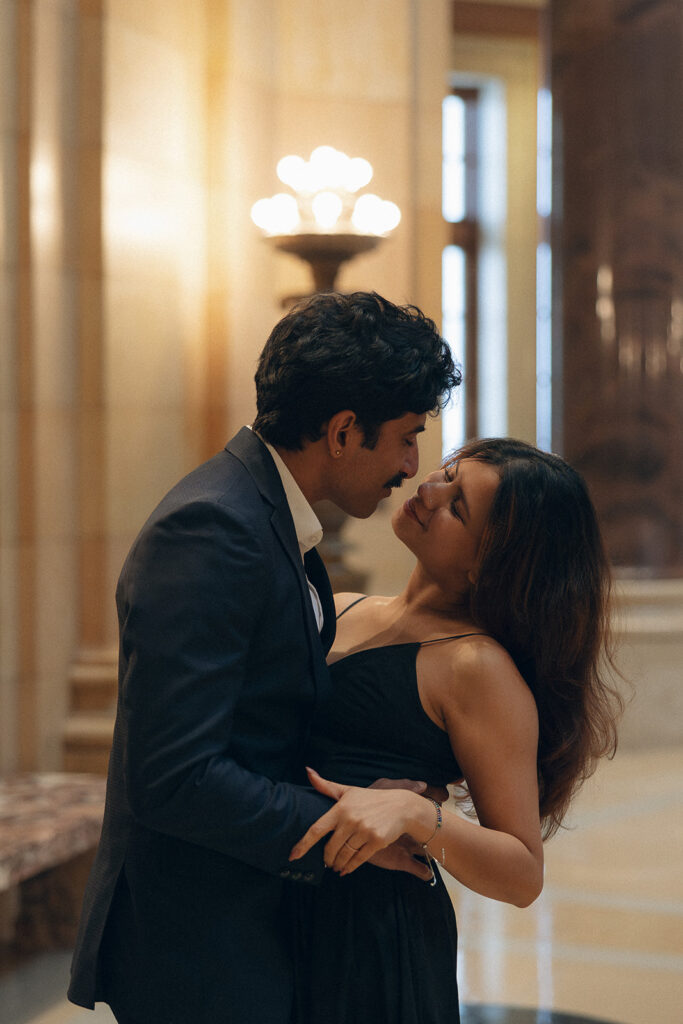 Shubhi tucked into Abhi’s arms, eyes closed and smile soft, wrapped in the kind of embrace that makes a cinematic engagement photo feel like a still from a love story.