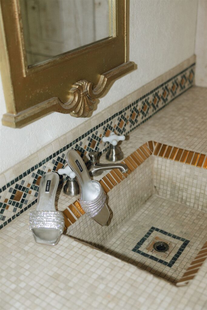 Bridal heels styled in the tiled sink at Edward Anne Estate, designed to echo old-world Italian charm
