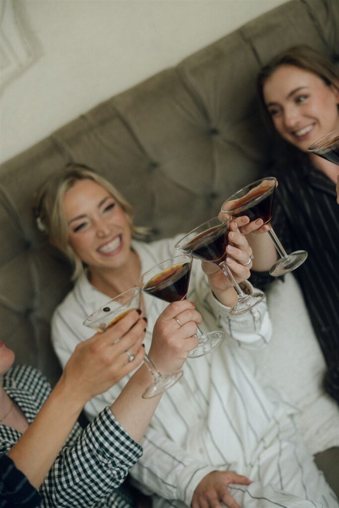 Bride sipping an espresso martini with her girls at Edward Anne Estate