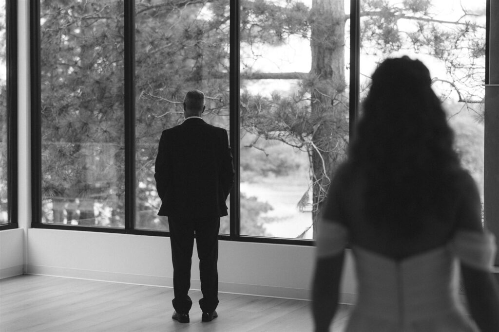 Bride walking toward her dad for their first look.