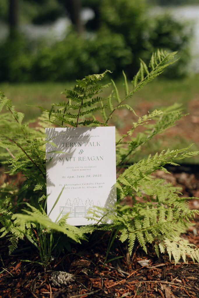 Invitation card tucked into outdoor greenery at Catalyst by Nature Link.