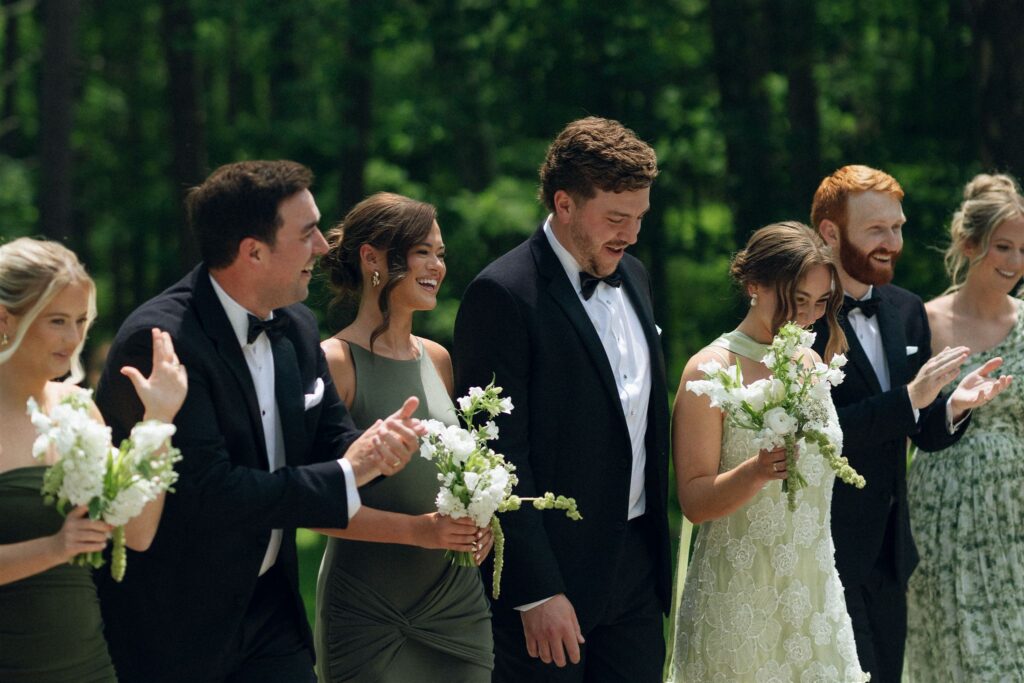 Wedding party cheering together at Catalyst at Nature Link in documentary style wedding photos.
