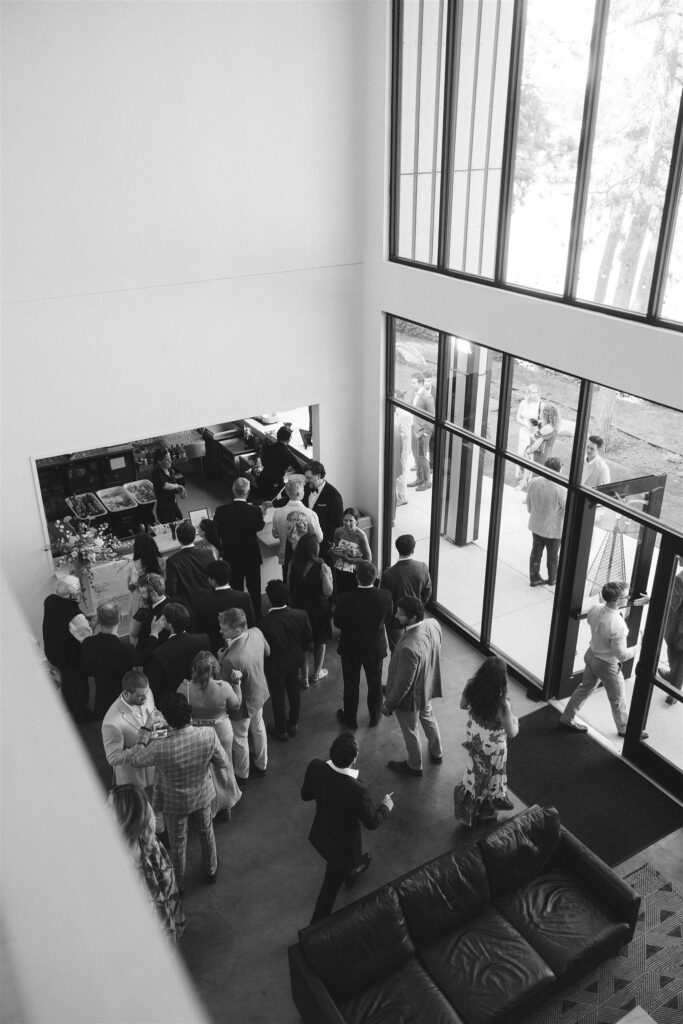 Guests mingling inside Catalyst at Nature Link before dinner.
