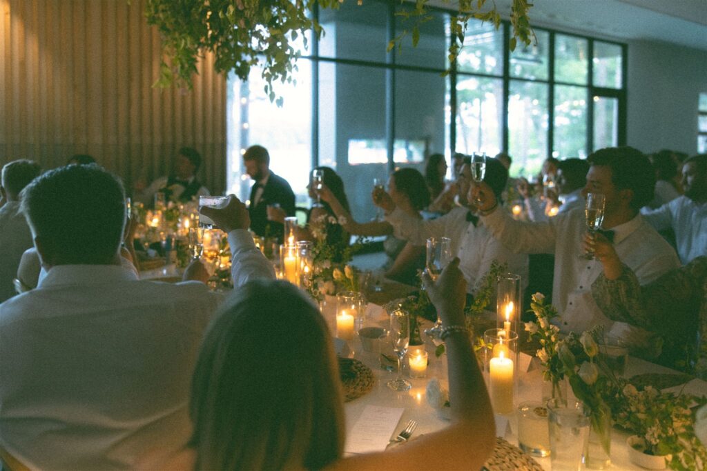 Guests applauding during toasts.