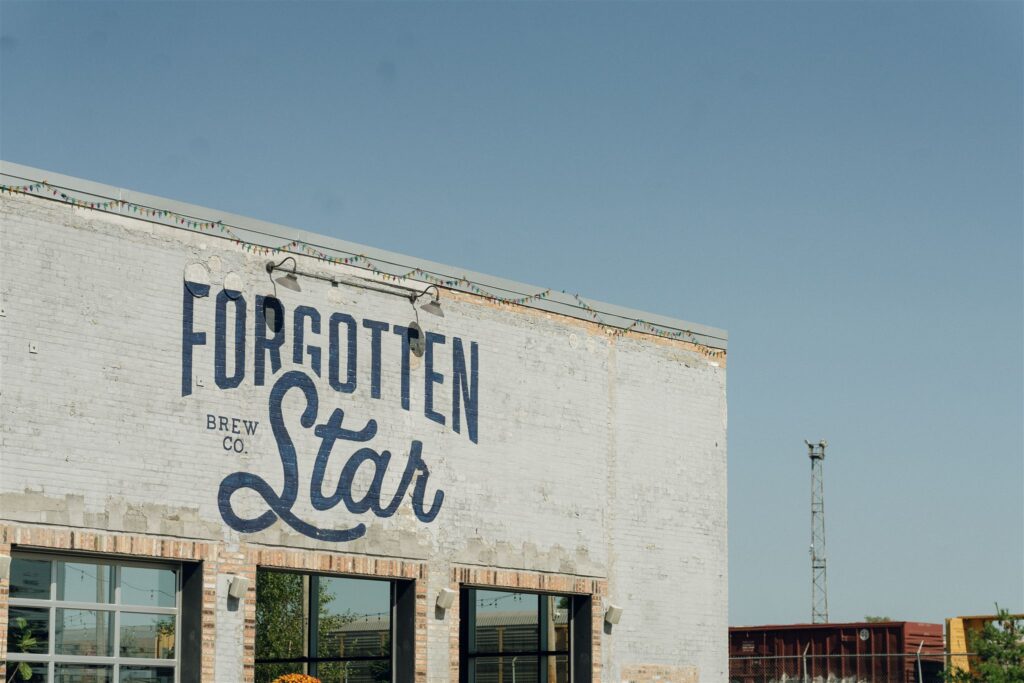 Exterior of Forgotten Star Brewing Co. in Minnesota, a popular industrial wedding venue often recommended by Minnesota wedding planners for couples seeking character-rich spaces.