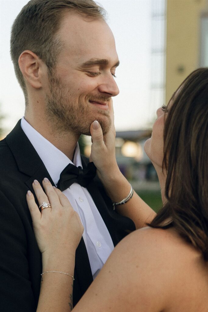 Close-up of a bride and groom sharing an intimate moment outdoors, highlighting emotional wedding storytelling favored by Minnesota wedding planners.